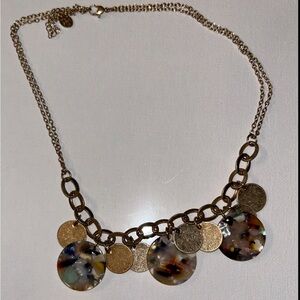elegant gold necklace featuring vibrant, multi-colored